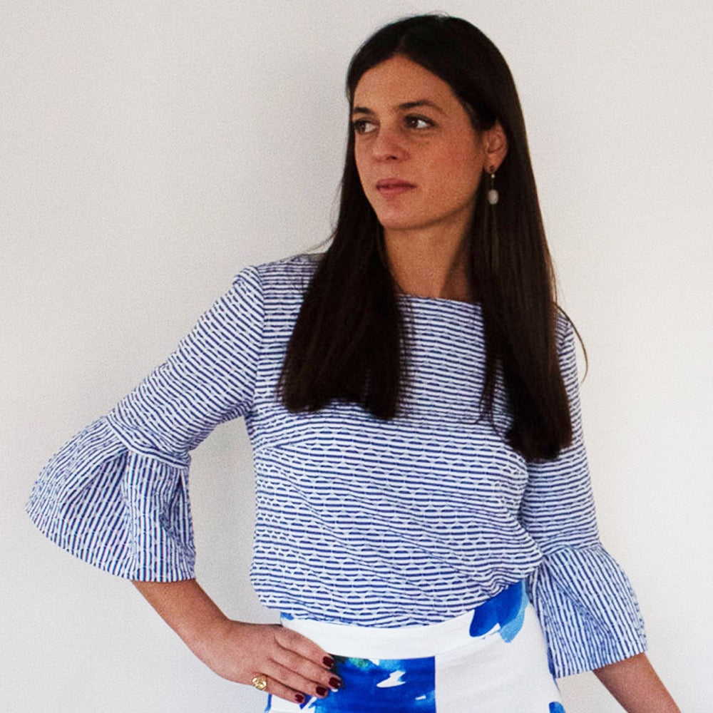 white and blue shirt  with bell sleeves 